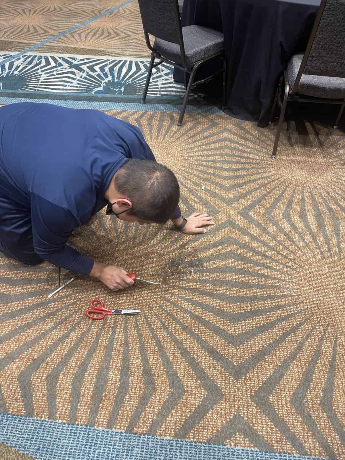 Commercial carpet repair in Raleigh & Durham NC – ProGreen technician fixing office carpet seams and patches
