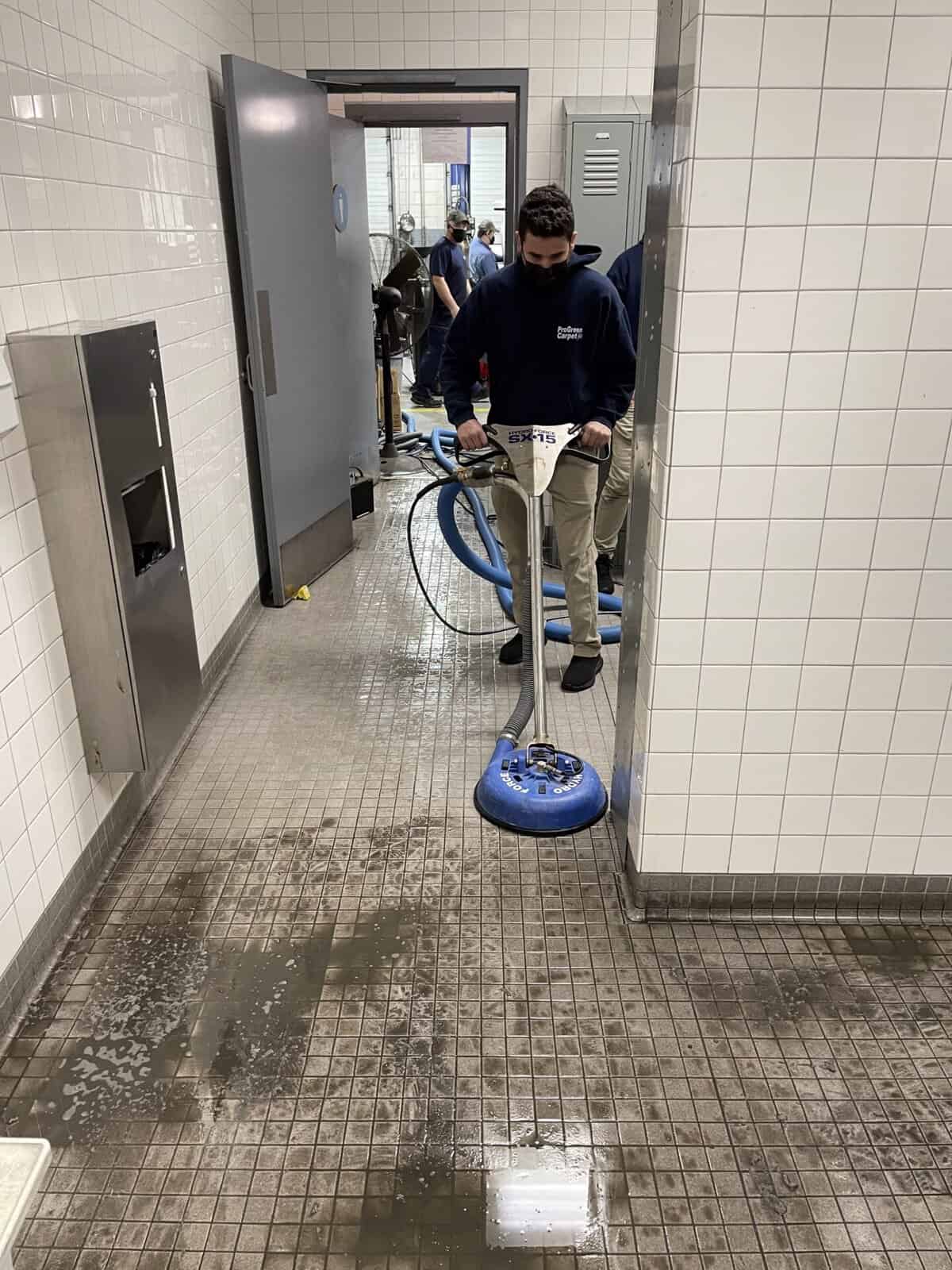 Commercial tile and grout cleaning in Raleigh & Durham NC – ProGreen technician cleaning restaurant or lobby floor