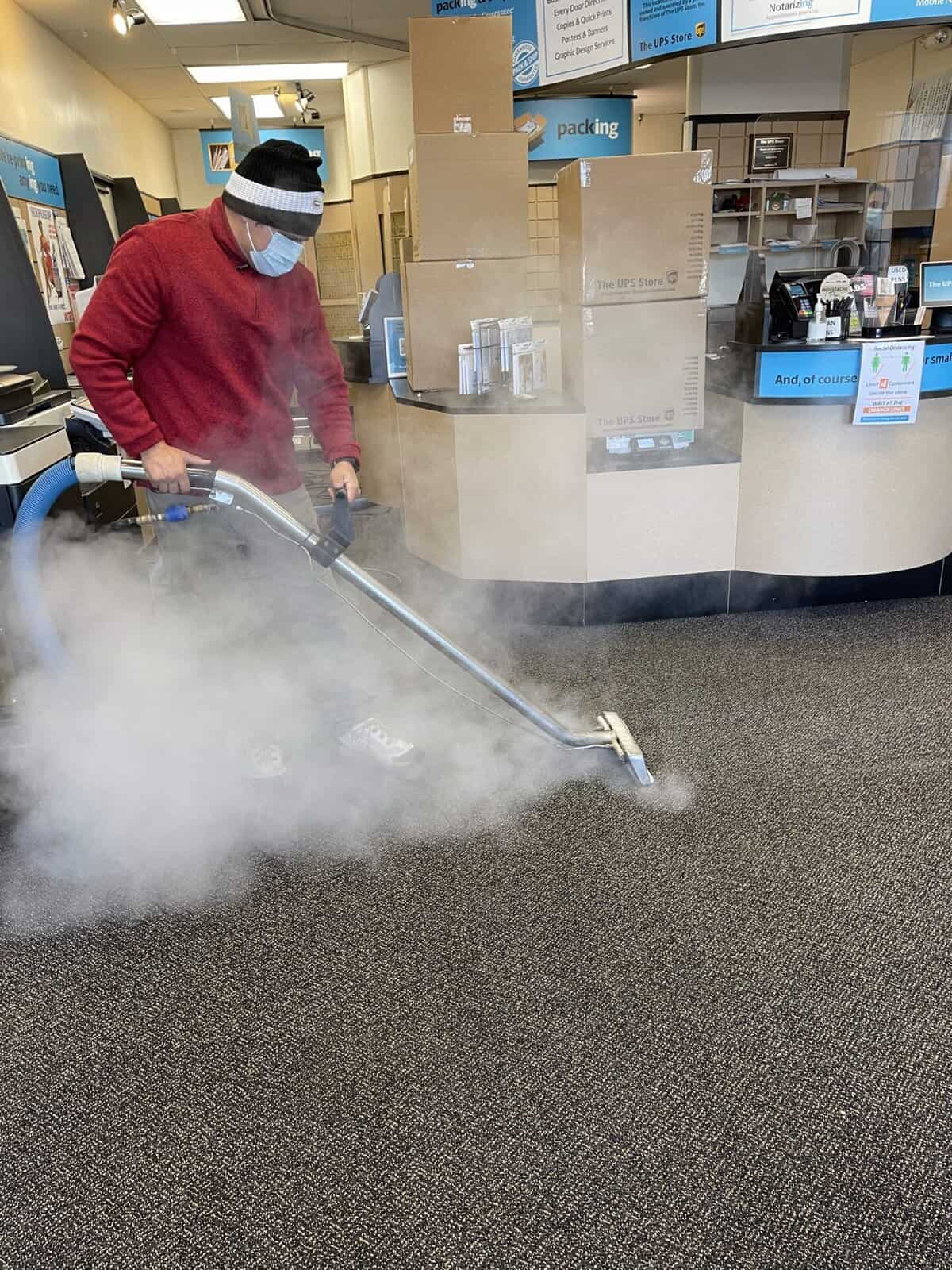 Commercial carpet cleaning in Raleigh & Durham NC – ProGreen technician cleaning office carpet