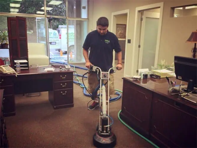 Commercial carpet cleaning in Raleigh & Durham NC – ProGreen technician cleaning office carpet