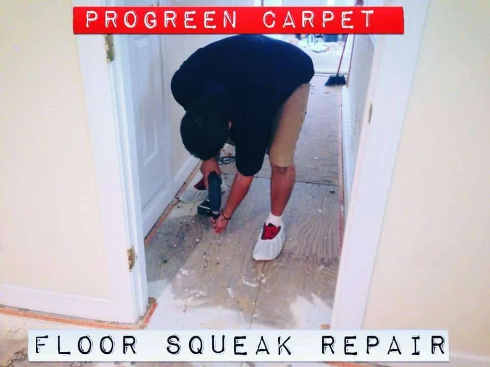 Technician fixing a floor squeak with power tools in a hallway in a Durham and Raleigh NC home, ProGreen Carpet
